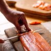 Slicing smoked salmon